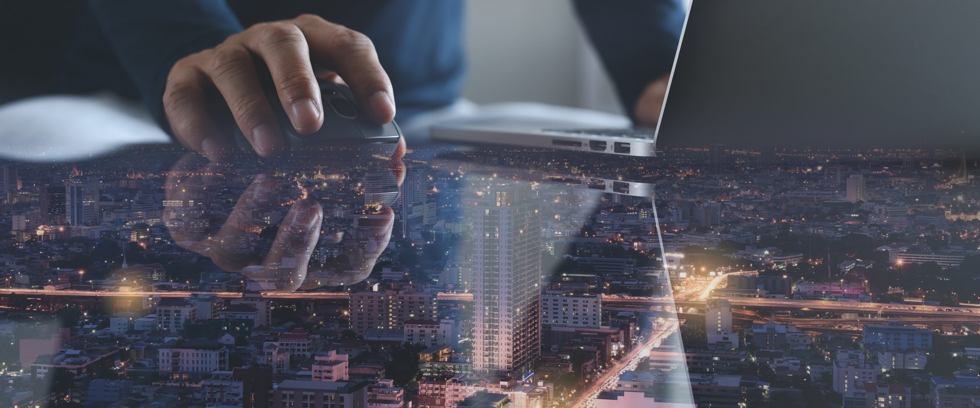 Wireless network communication, 4.0 digital technology development concept. Double exposure of man using wireless mouse and laptop computer with smart city with reflection on desk